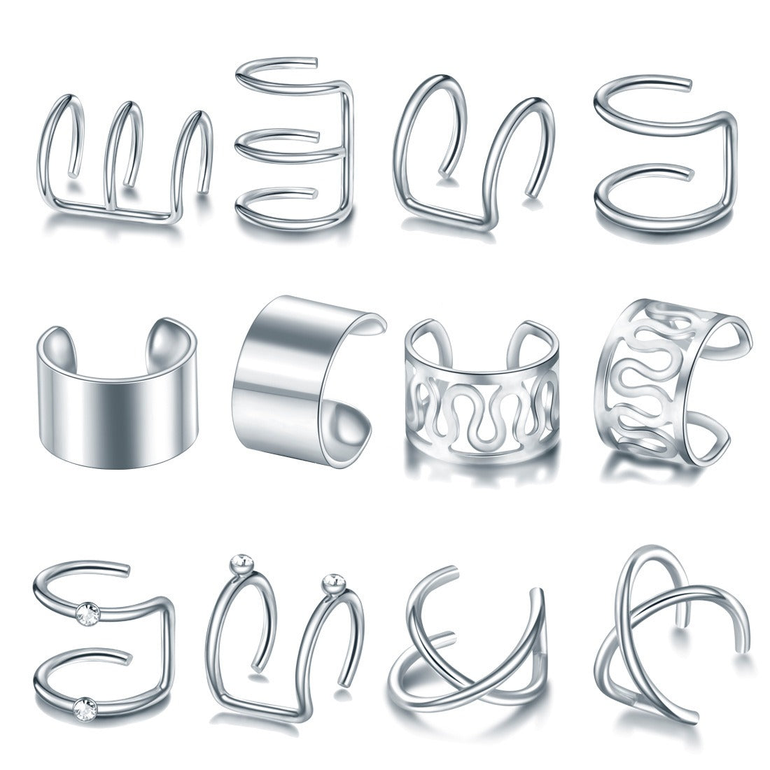 Twelve silver tone ear cuffs laid out in rows