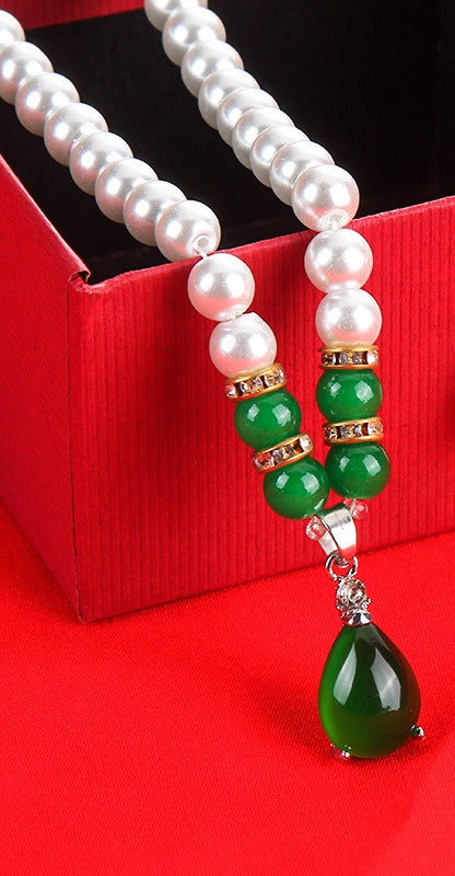 Close up of the green teardrop pendant
