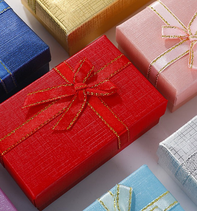 Small gift boxes with ribbon bows