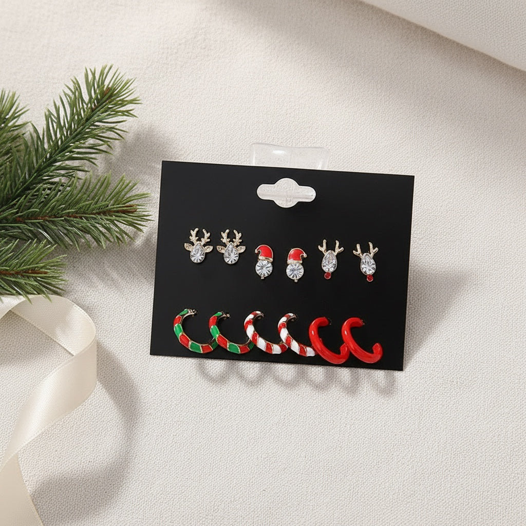 The Christmas earring card laid flat on ivory linen