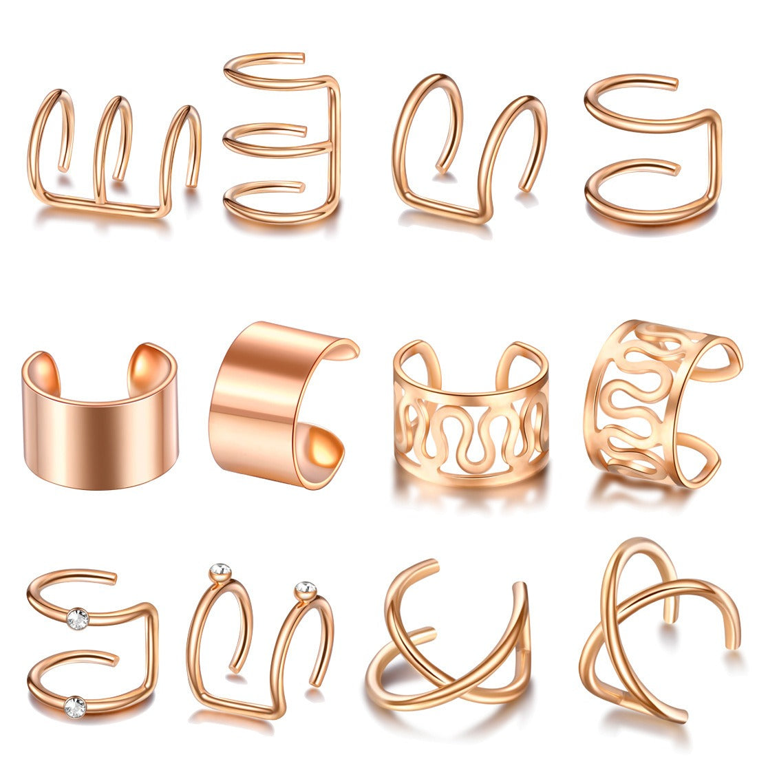 Twelve rose gold tone ear cuffs laid out in rows
