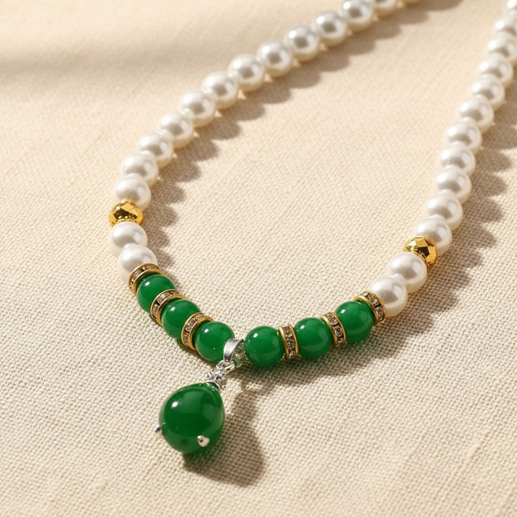 Close up of the green beads and the green teardrop pendant