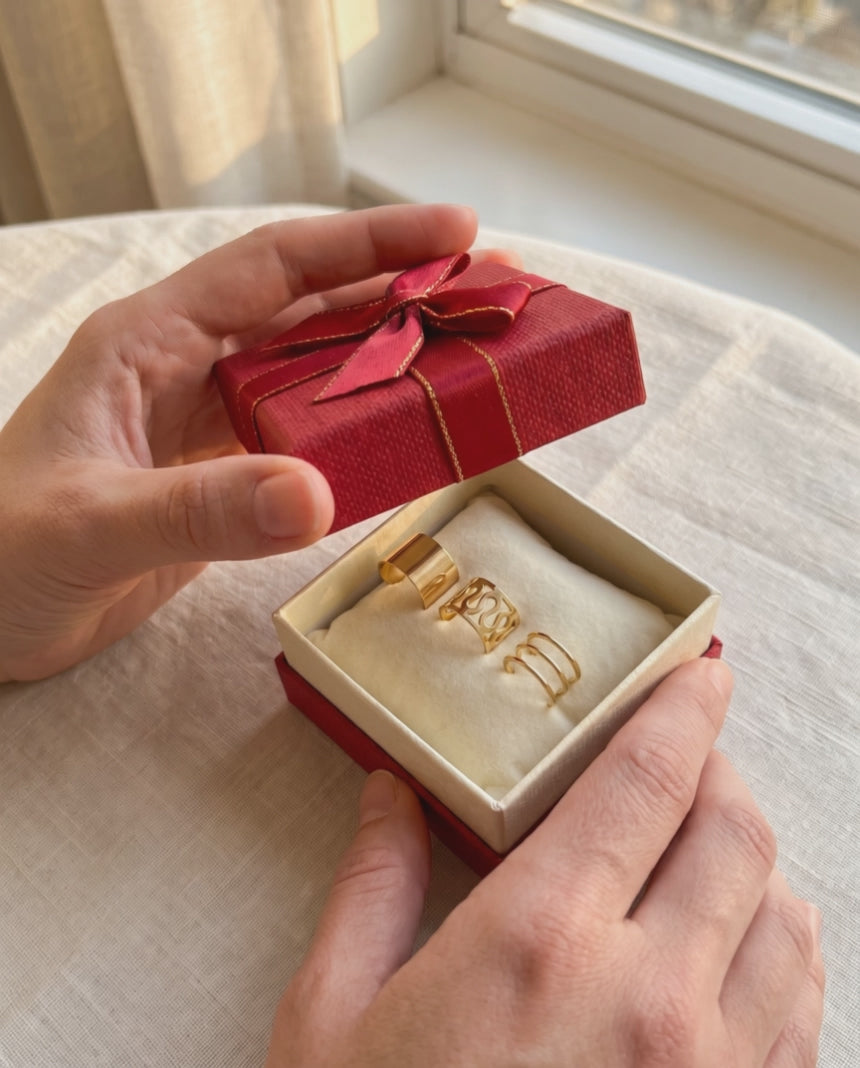Video: a gift box opened to show three gold tone ear cuffs